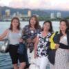 Posing with the Honolulu skyline as background